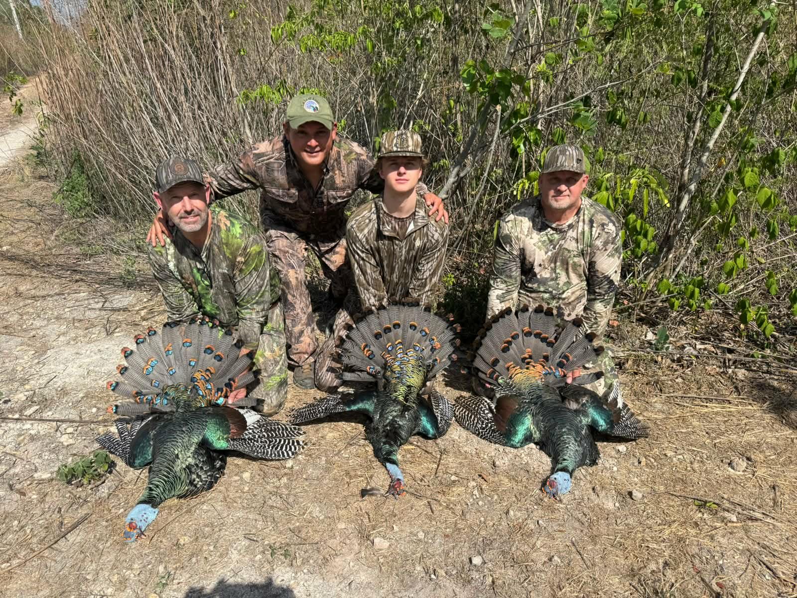 image of hunters with 3 trophy Goulds Turkeys